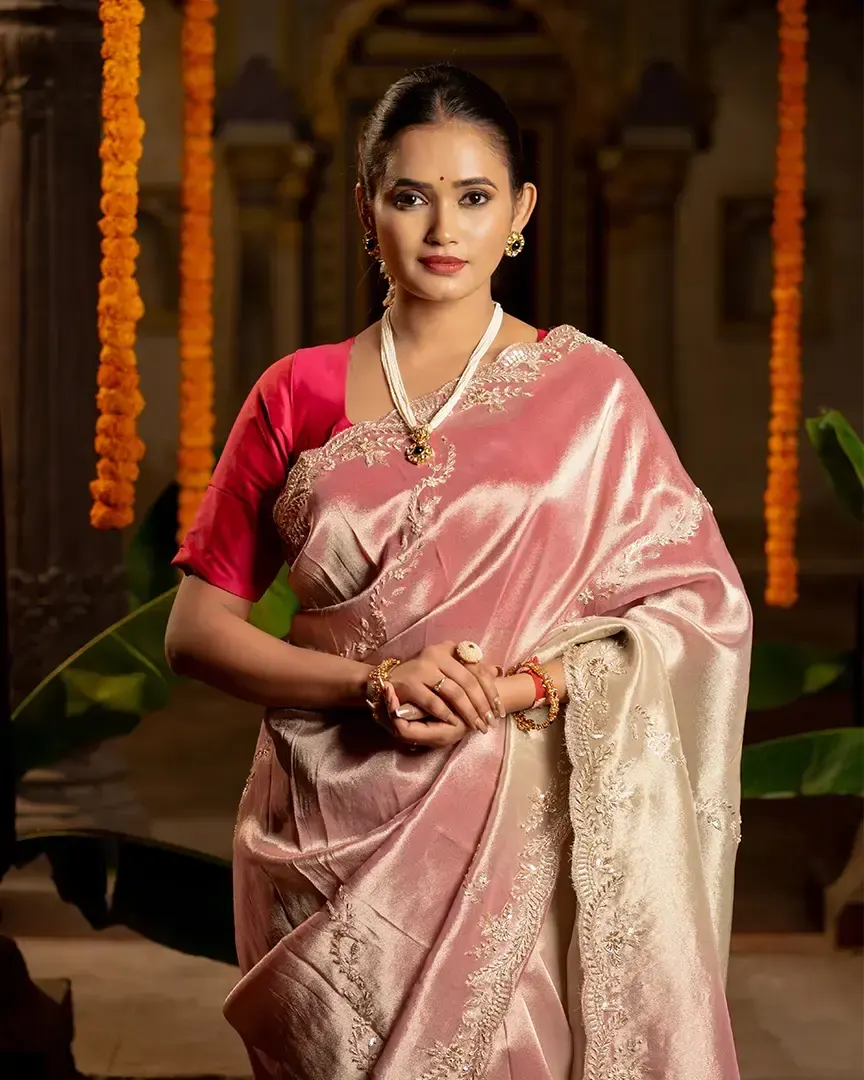 Model in a pink silk saree