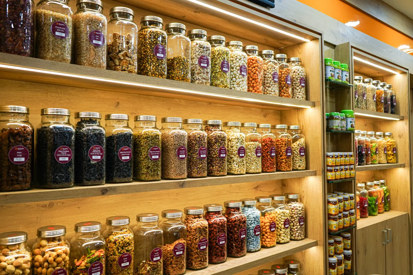 Shelves of dry fruit jars in a store
